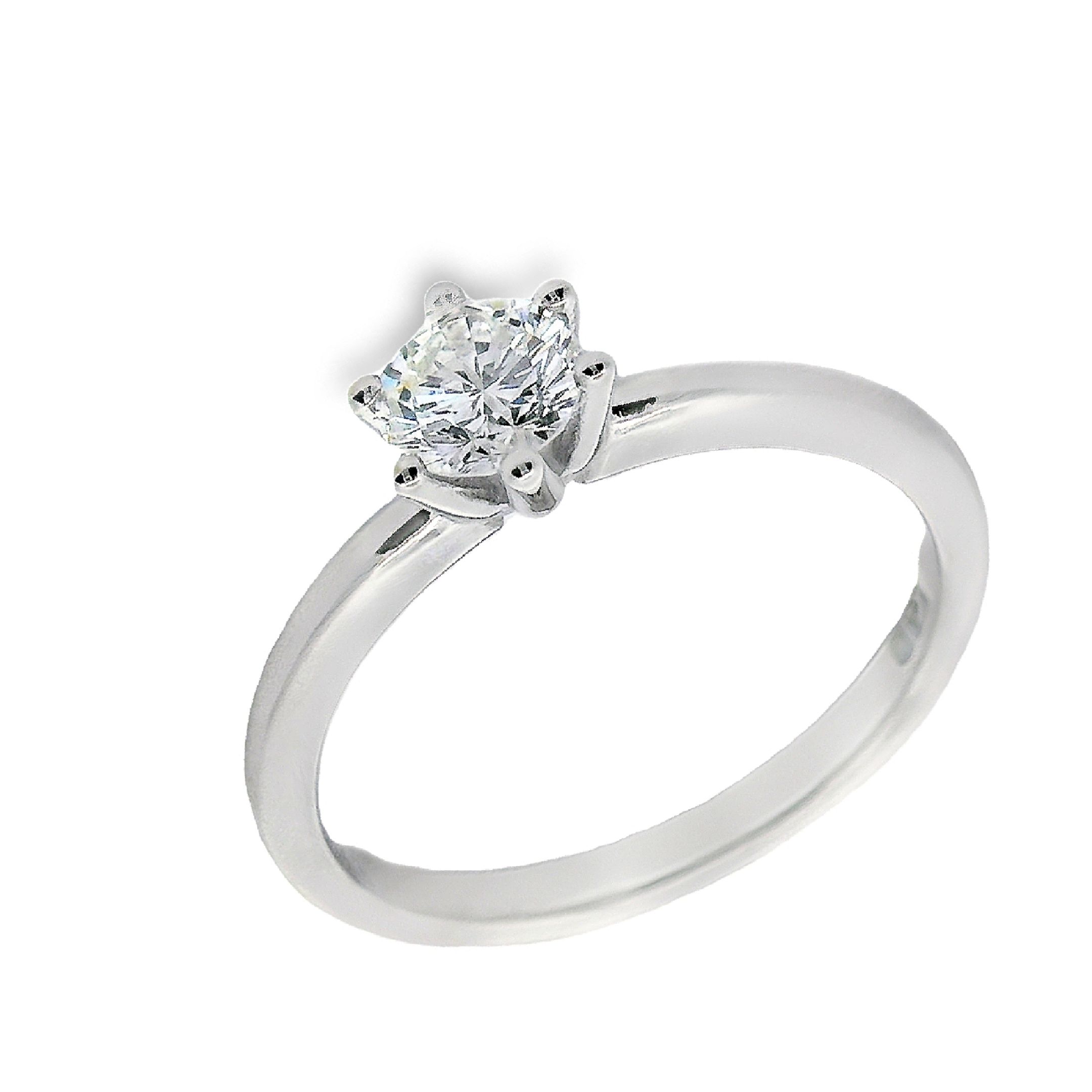 Deze ring van Louis Bros is vervaardigd uit 18 karaat witgoud (3.61 gr.) en is gezet met 1 briljant geslepen diamanten met een totaalgewicht van 0.50ct. De ring heeft een diameter van 5 mm, minimale breedte van 2 mm. en een hoogte van 5 mm. Deze ring straalt klassieke elegantie uit. Het witgoud geeft de ring een tijdloze en verfijnde uitstraling, terwijl het diamantje in het midden een subtiel maar stralend accent vormt. Deze klassieke en elegante ring is perfect voor iedereen die houdt van een tijdloos en ingetogen sieraad. Met deze ring om je vinger voel je je gegarandeerd stijlvol en chic!
De ring is verkrijgbaar in meerdere afmetingen.